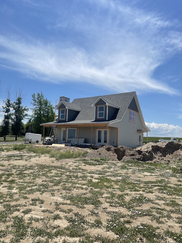 Custom-built farmhouse exterior under construction in Magic Valley
